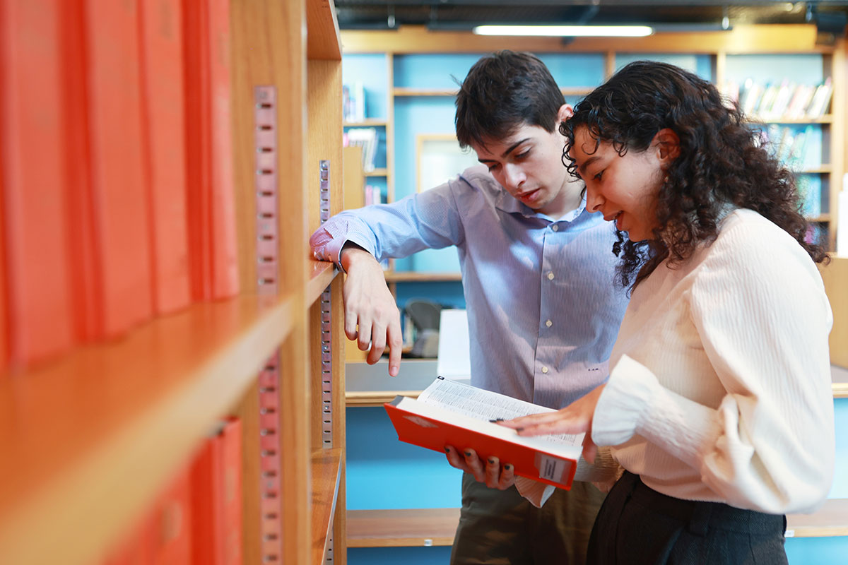 Younger members looking at book