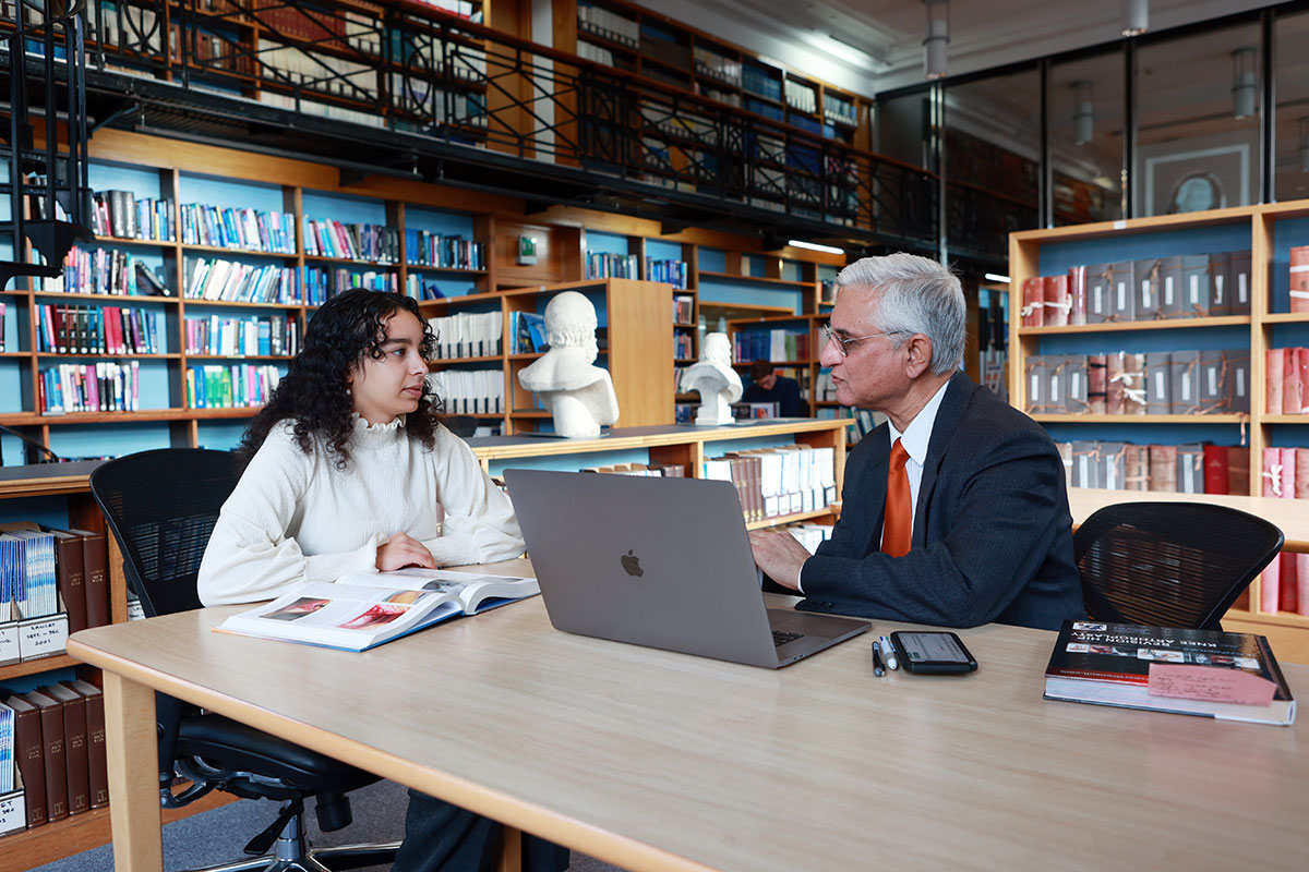 Two members at computer