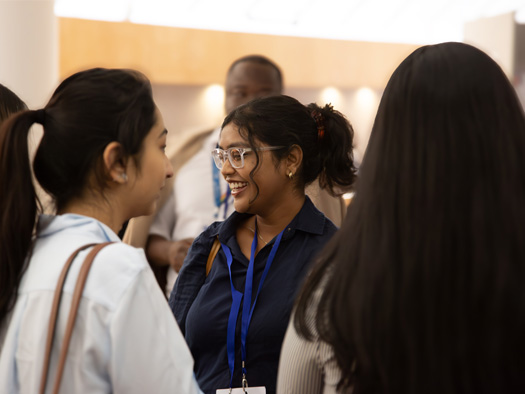 Young women smiling in crowd - Promo