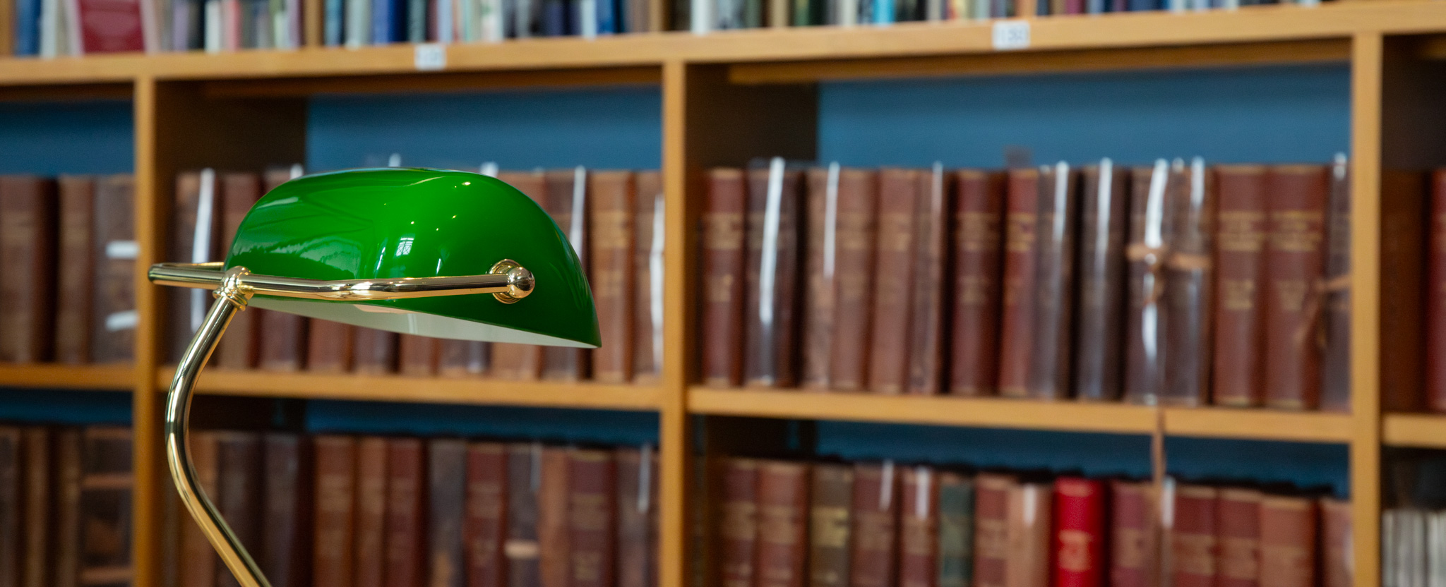 Library desk lamp with brown books - Promo